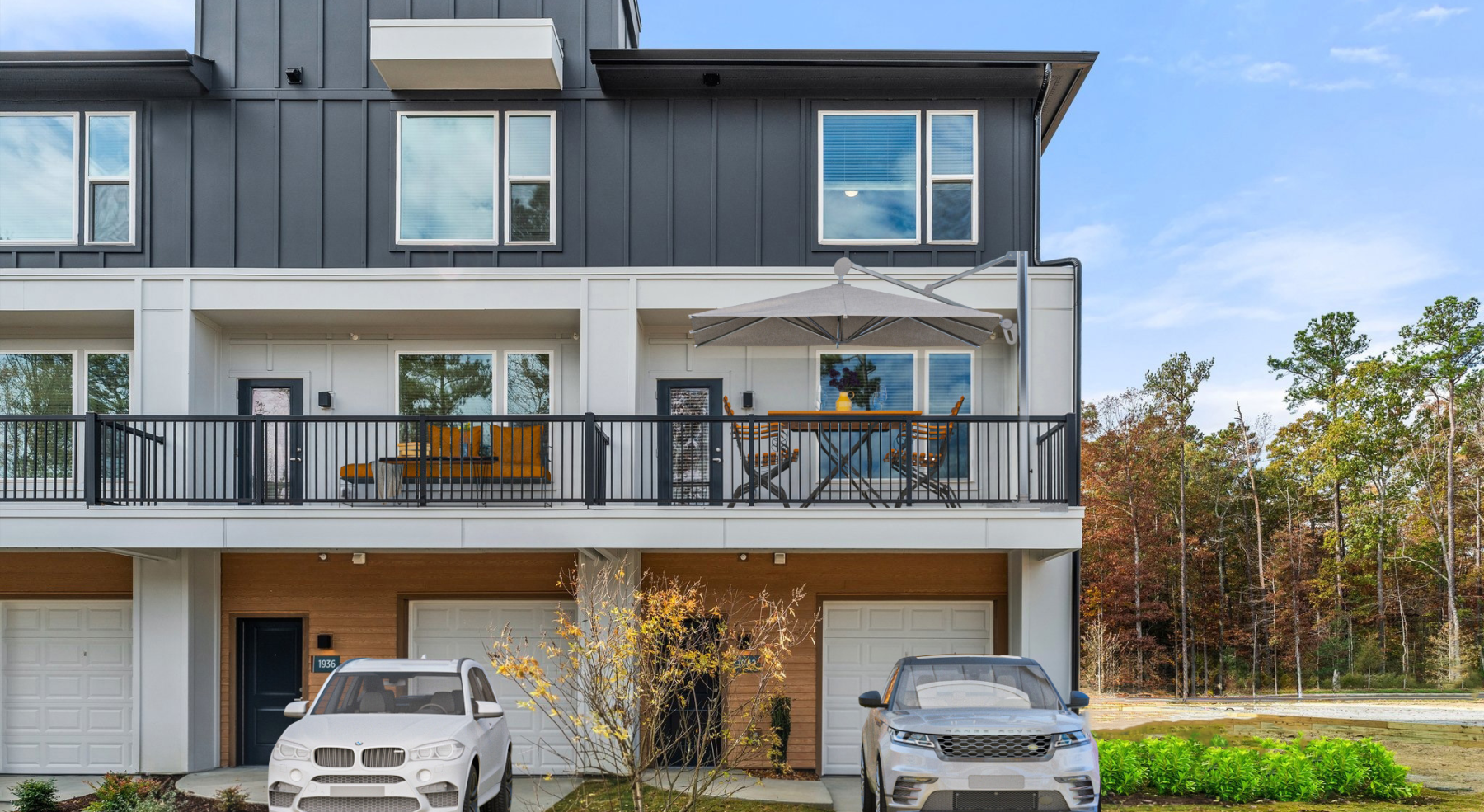 backside of townhome with garage and patio