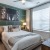 carpeted bedroom with large window