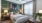 carpeted bedroom with large window