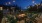 chairs around lighted fire pit at night