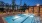 outdoor swimming pool lit at nght