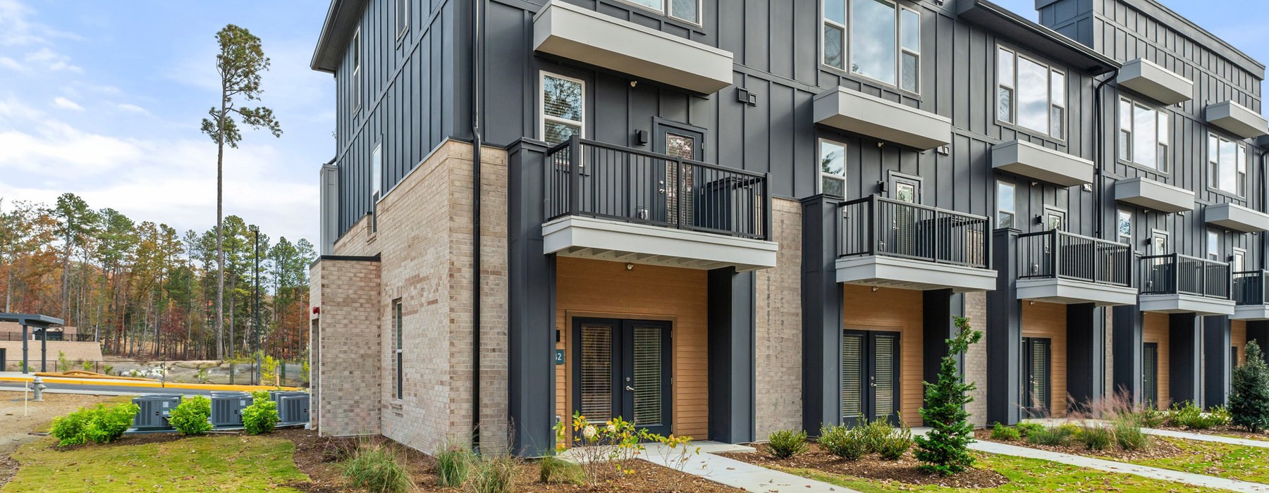 townhomes with walkways and a view of other homes